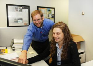 Wade Knapper, chief business officer for LDA Engineering and Maryville College graduate, discussed a project with Riley McMillan in the offices of LDA Engineering.